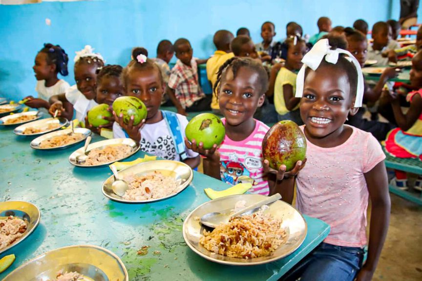 Why we exist, to give lunch is one reason. Happy children with a great school lunch.
